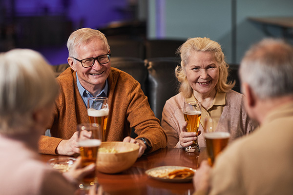 group of friends sitting around drinking beer and chatting